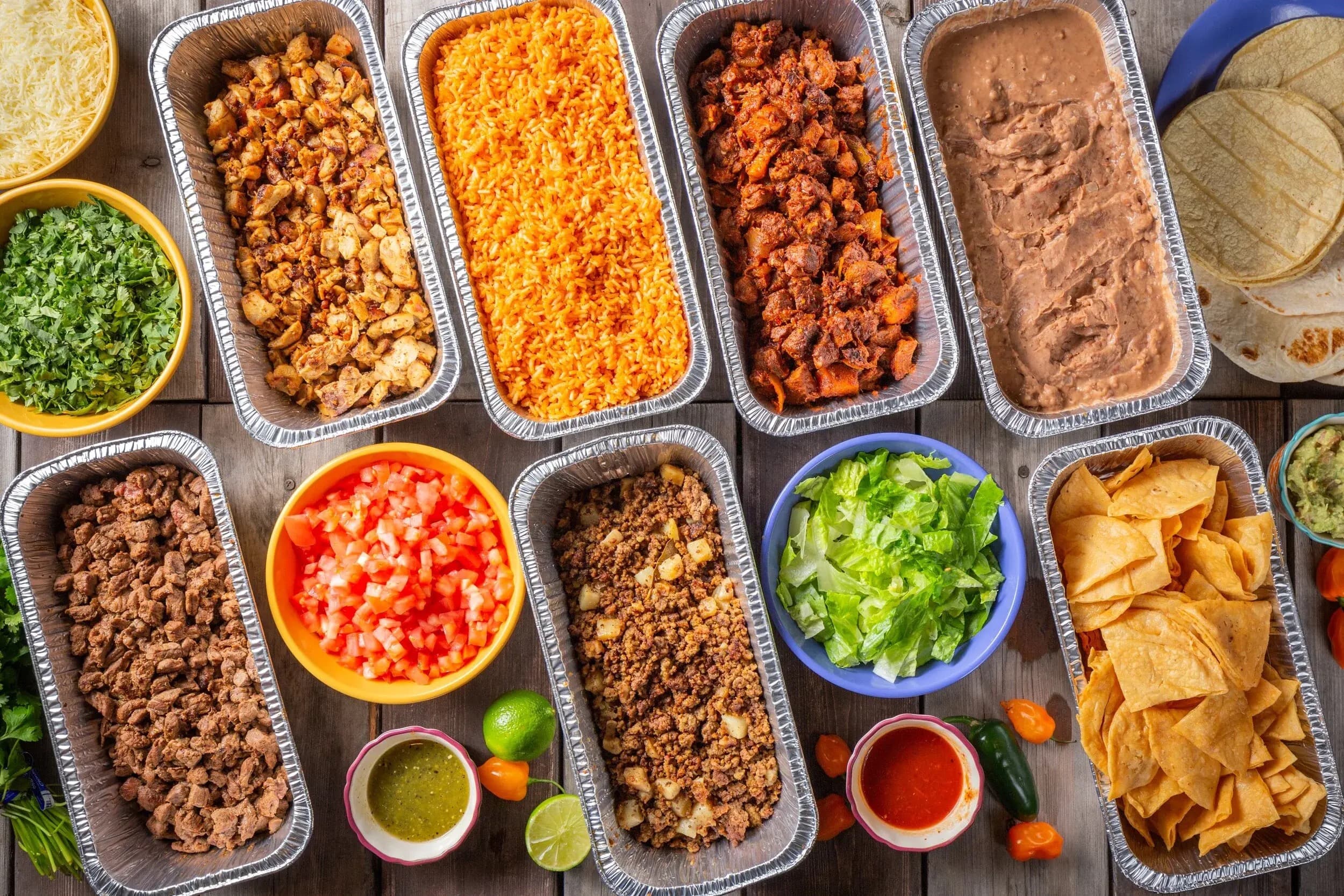 La Rio's buffet spread with proteins, rice, beans, tortillas, toppings and sauces